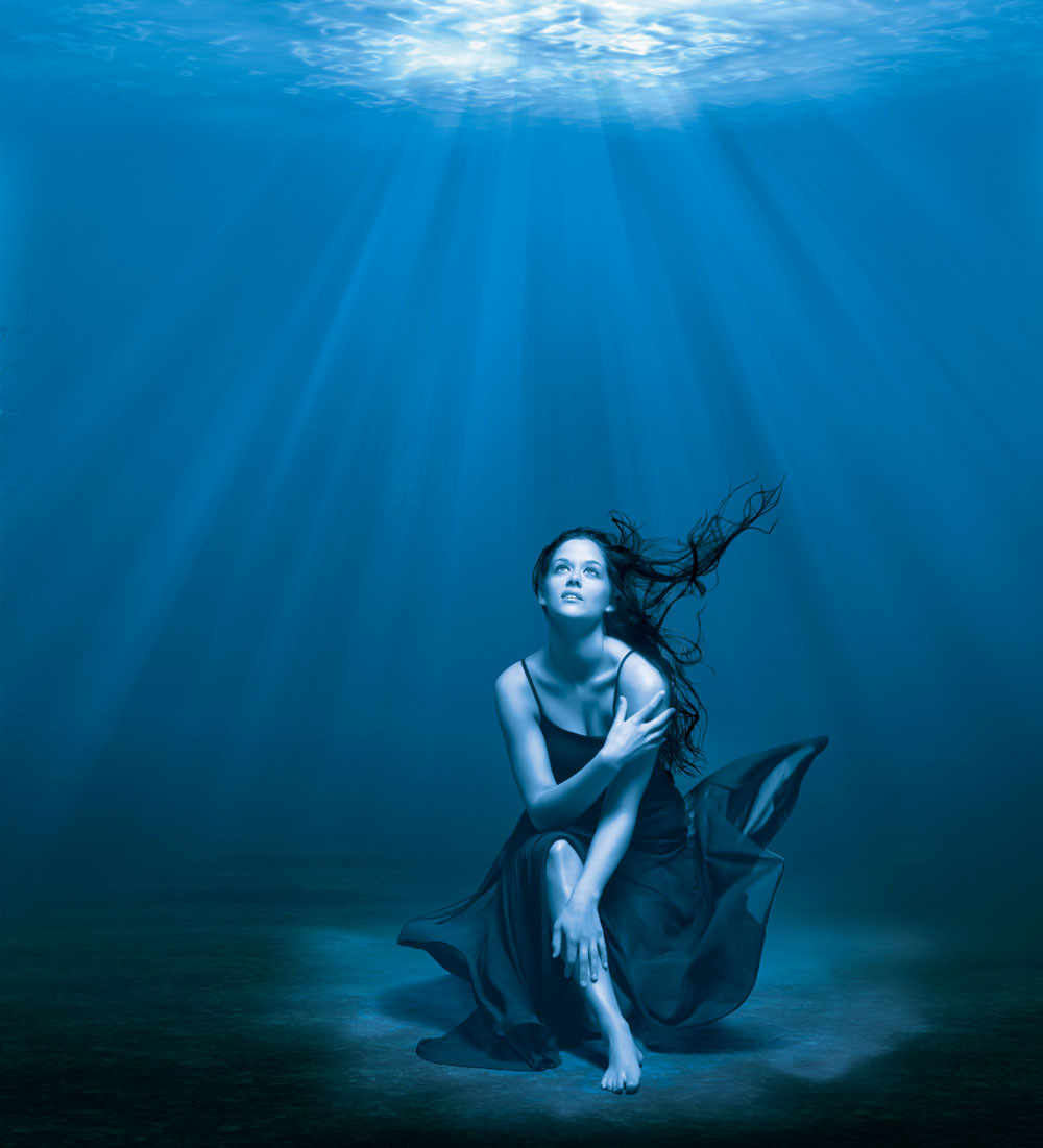 Retouched image of a woman underwater for Barbicide.