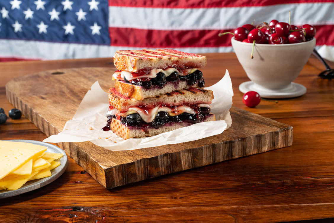 Food photography of a grilled cheese with patriotic background