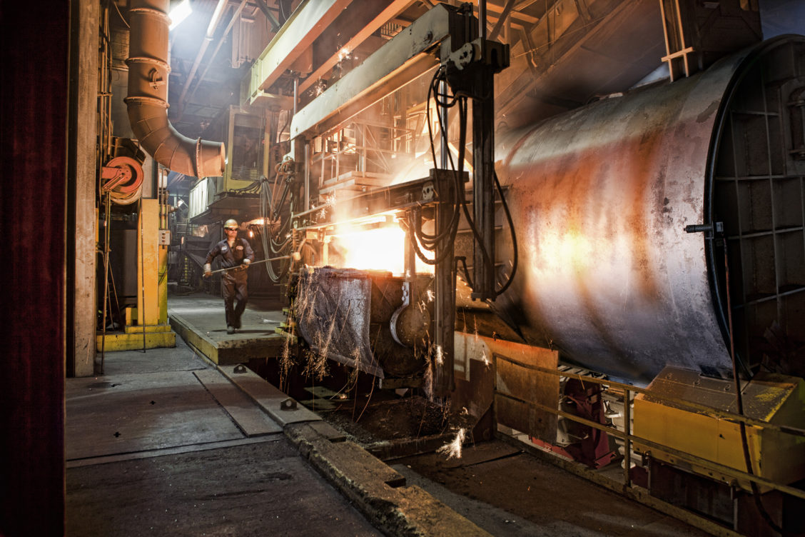 Photo of a worker in an industrial setting for Waupaca Foundry