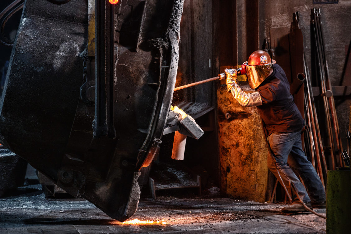 Photograph of a worker in an industrial setting for Waupaca Foundry