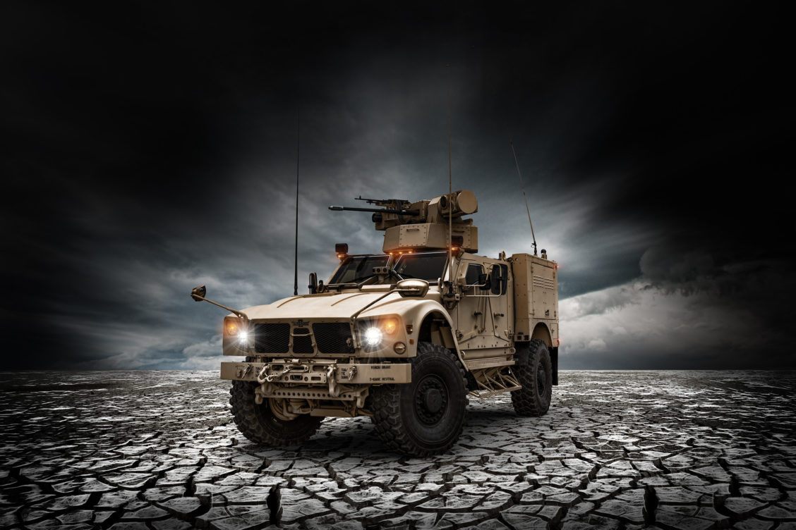 Product photography of an Oshkosh Defense vehicle with a retouching done to the background.