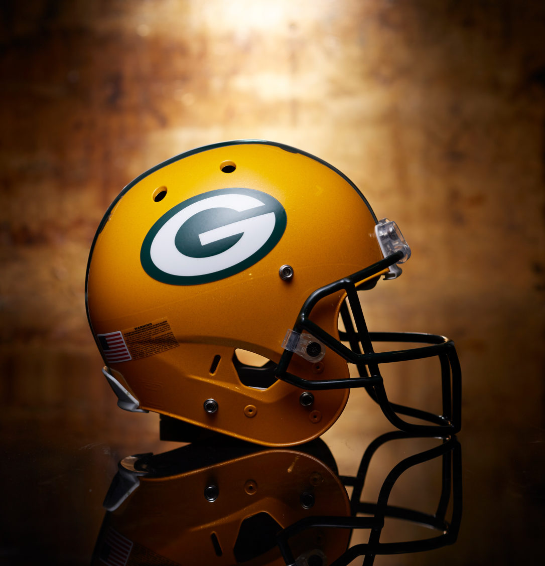 Product photography of a Green Bay Packers helmet.