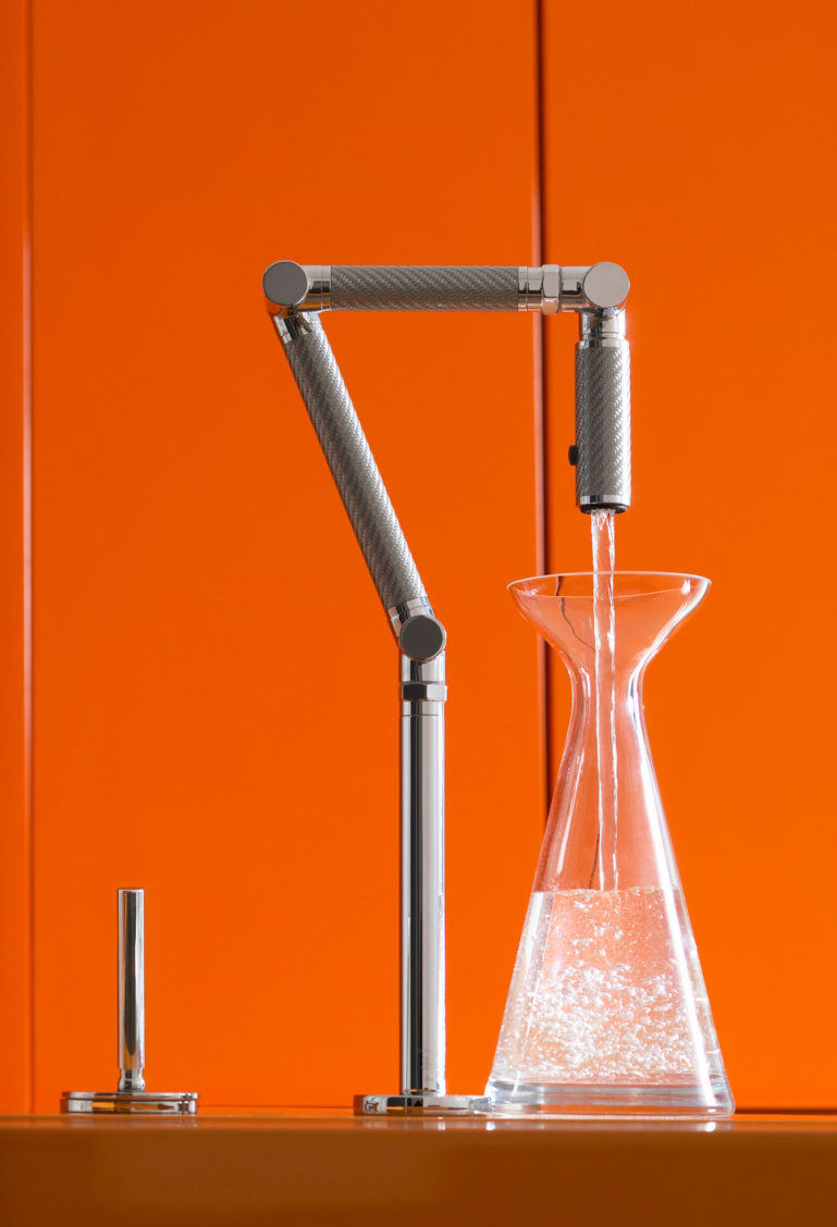 Product photography of a sink and beaker in a lab setting.