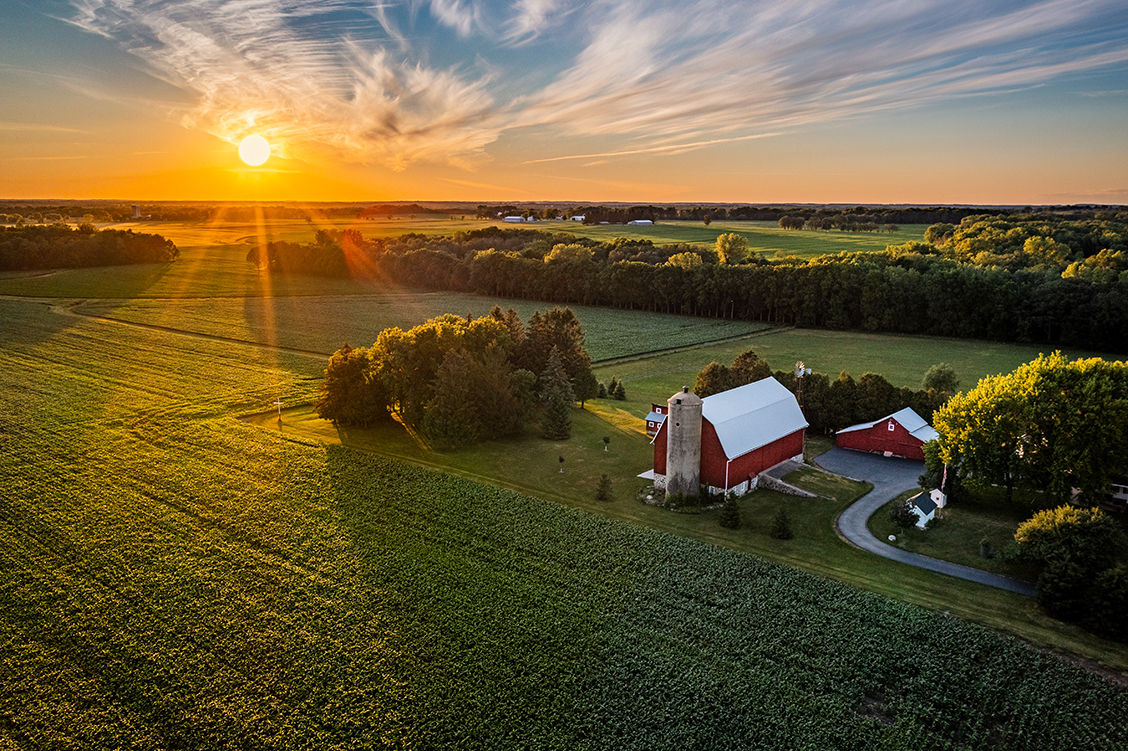 Drone photo of a farm at sunset